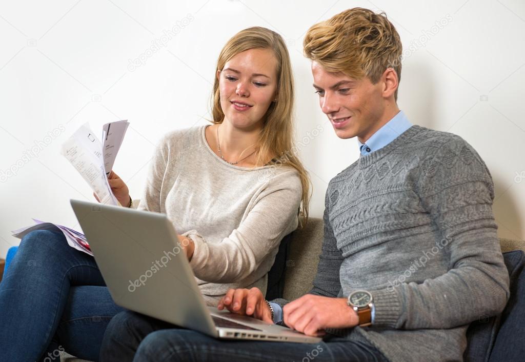 Couple comparing their expenditure