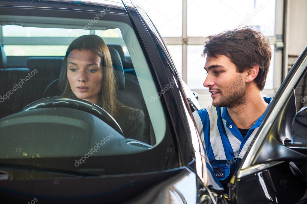 woman behind the wheel of  car