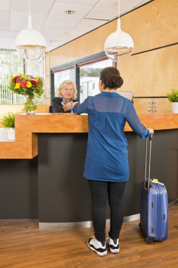 senior receptionist providing  customer service clipart