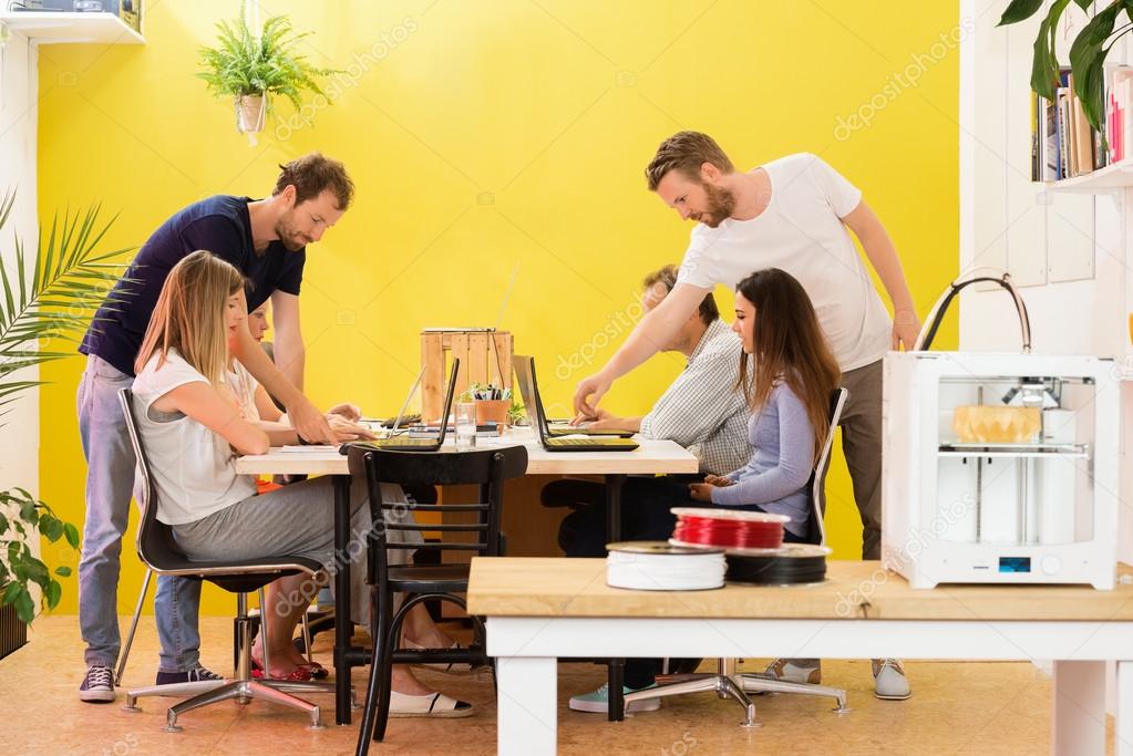 Printer Machine With Designers In Background