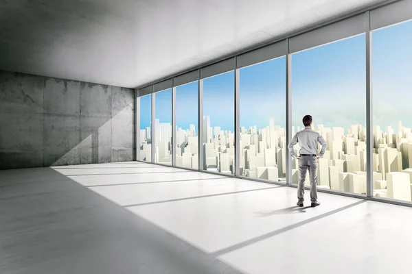 Business man standing inside an office building looking outside — Stock Photo, Image