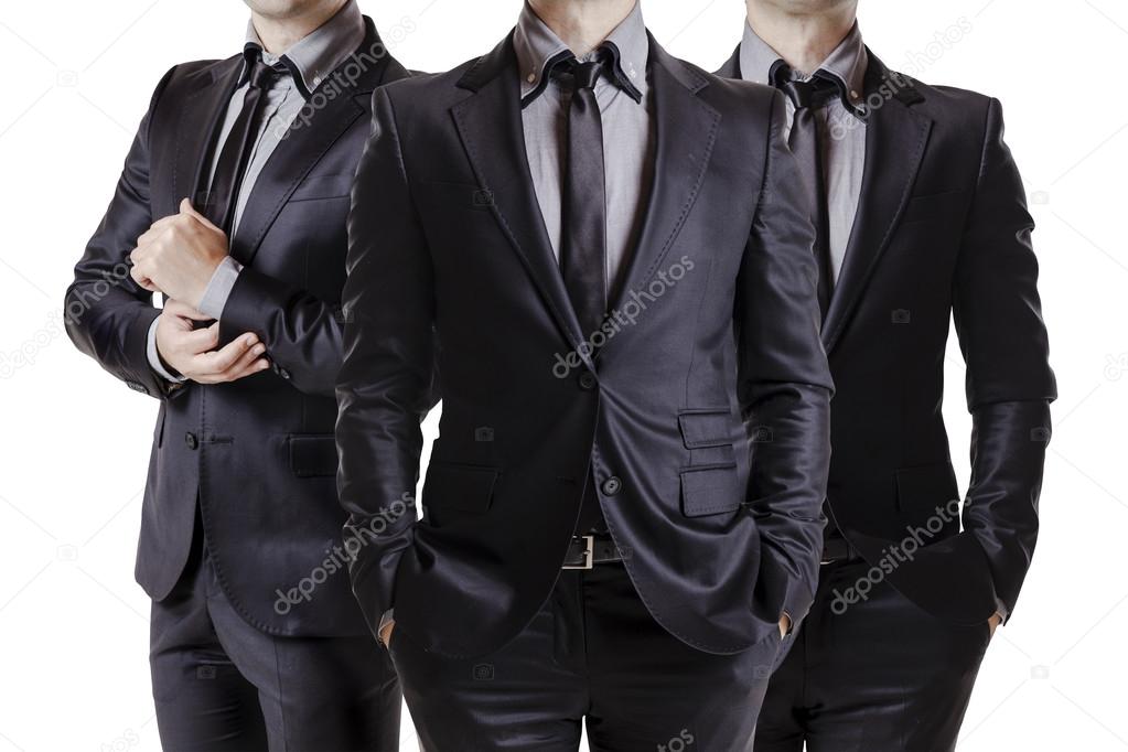 Close up image of three business men in black suit