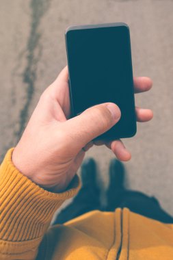 Using smartphone mobile on the street