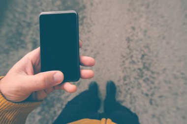 Using smartphone mobile on the street