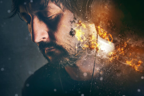 DJ on fire, man with burning headphones