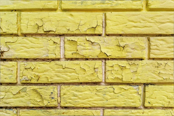 Peeling vernice gialla di mattoni superficie muraria — Foto Stock