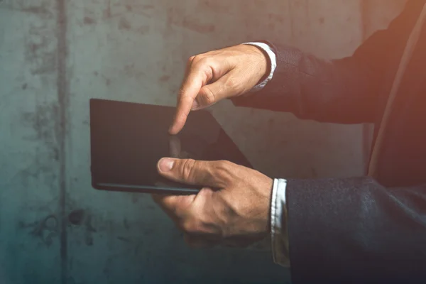 Unrecognizable businessman using digital tablet finger pressing — Stock Photo, Image