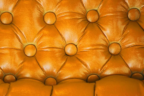 Texture of vintage yellow leather upholstery with buttons — Stock Photo, Image