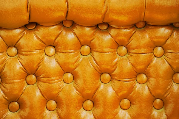 Texture of vintage yellow leather upholstery with buttons — Stock Photo, Image