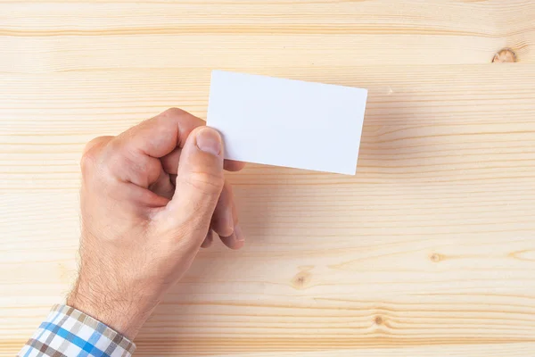 Top view of businessman holding blank business card — Stock Photo, Image