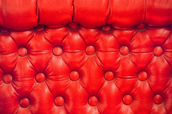 Texture of vintage red leather upholstery with buttons — Stock Photo, Image