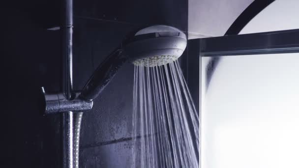 Bathroom shower head, water running out and drops falling slowly — Stock Video