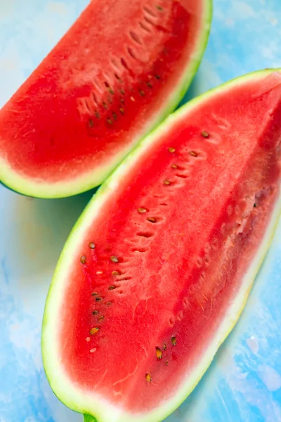 Watermelon slices on rustic blue wooden table — Stock Photo, Image