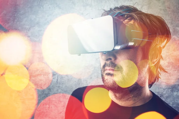 Man with virtual reality goggles watching 3d VR multimedia conte — Stock Photo, Image