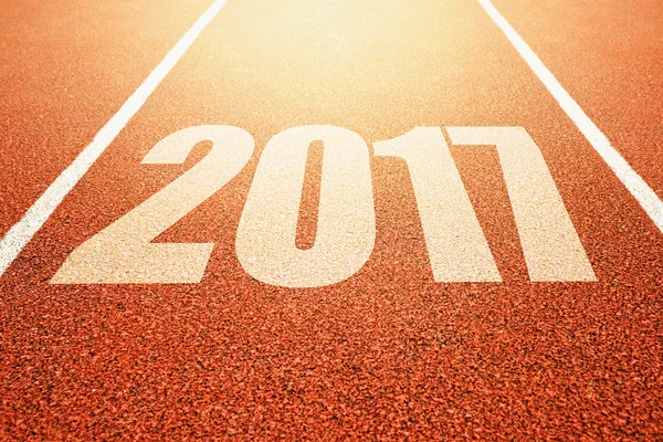 2017 Feliz Ano Novo, esporte de atletismo conceito de pista de corrida — Fotografia de Stock