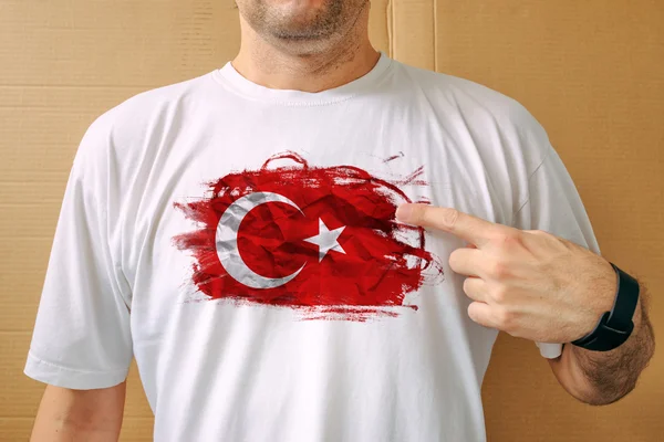 Handsome man proudly wearing white shirt with Turkish flag — Stock Photo, Image