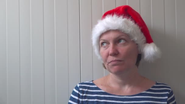 Disappointed woman with Christmas Santa Claus hat suffering from depression — Stock Video