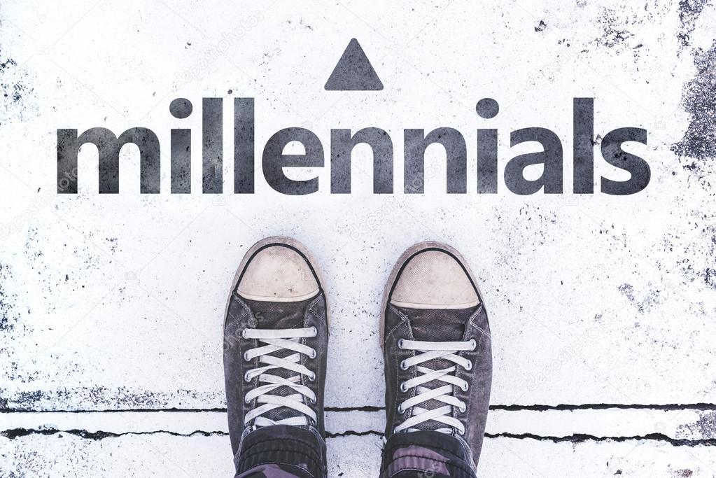 Millennials concept with pair of sneakers on the pavement