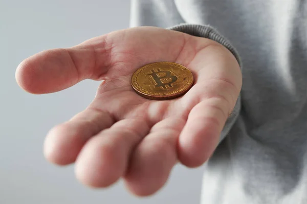 Hand Offering Bitcoin Cryptocurrency Coin Close Selective Focus — Stock Photo, Image