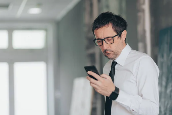 Serious Businessman Reading Text Message Smart Phone Close Selective Focus —  Fotos de Stock