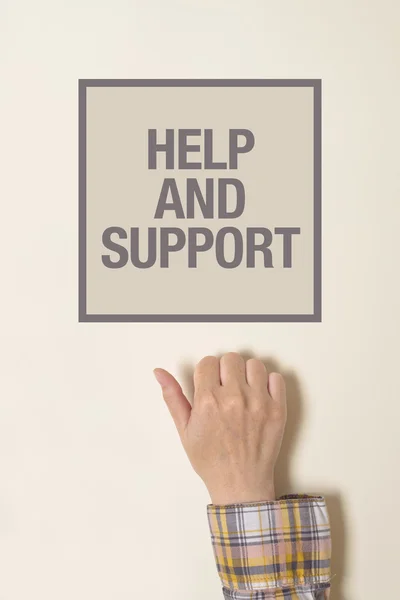 Hand is knocking on help And Support door — Stock Photo, Image