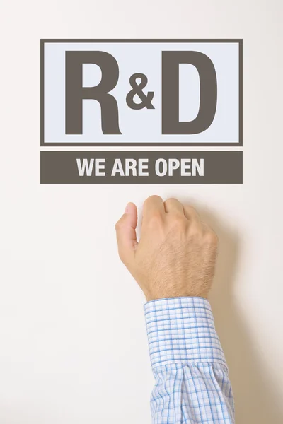 Businessman knocking on Research and Development department door — Stock Photo, Image