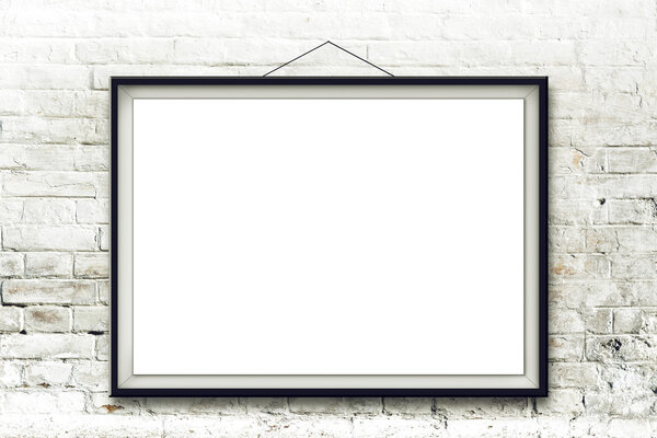 Blank horizontal painting in black frame hanging on white brick wall. Picture proportions match international paper size A.