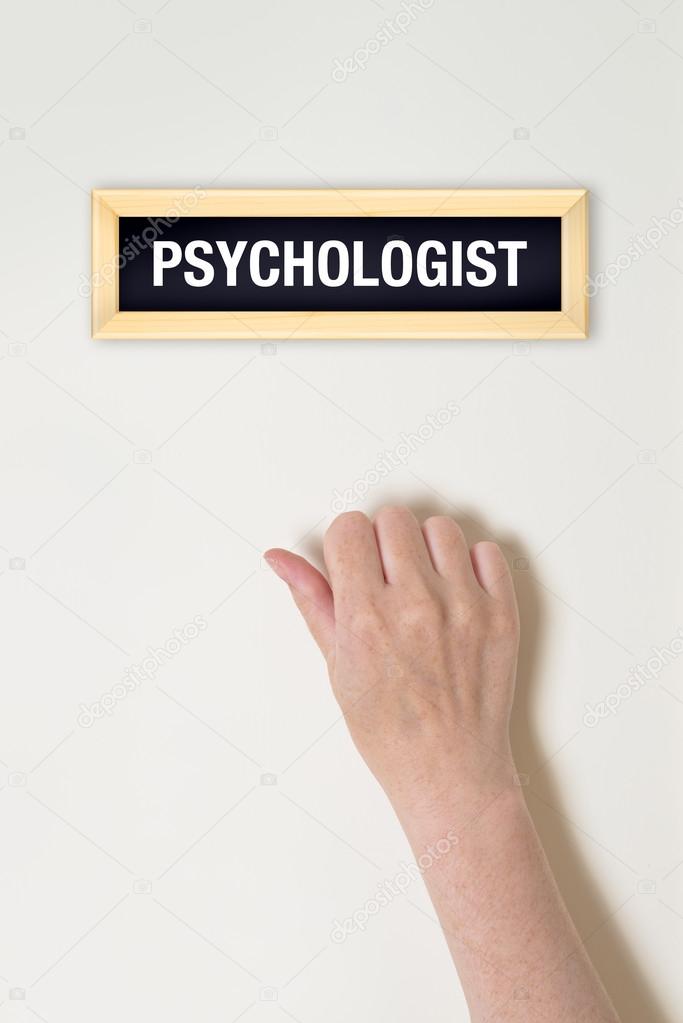 Female hand is knocking on psychologist door