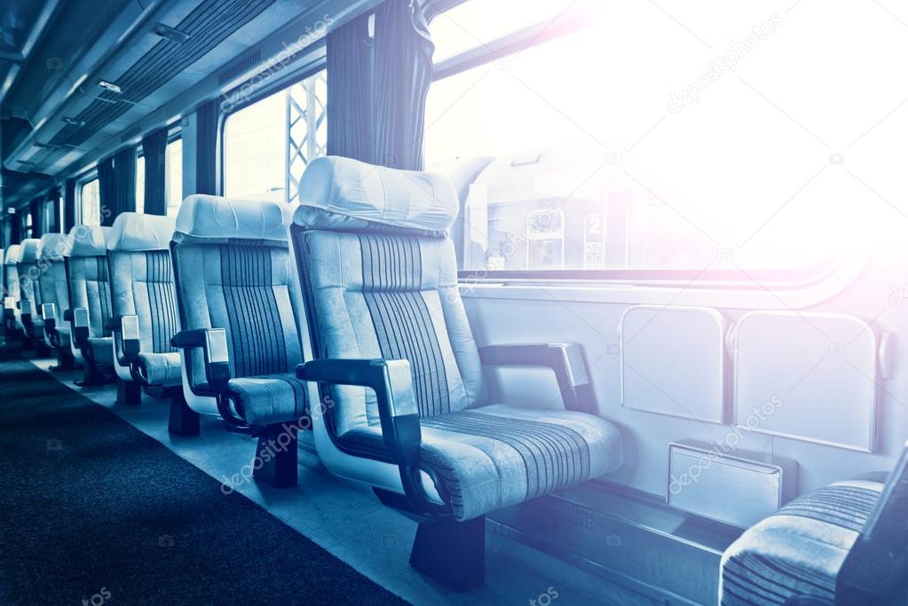 Passenger train interior with empty eats