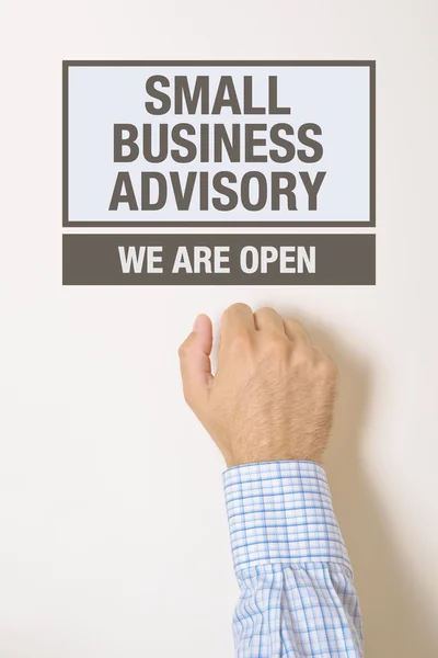 Businessman knocking on Small business advisory door — Stock Photo, Image