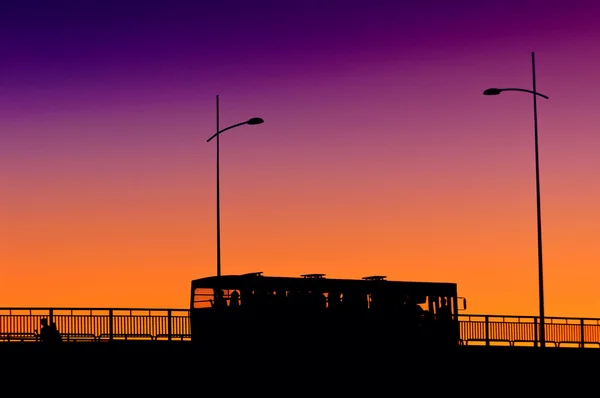 City bus in sunset — Stock Photo, Image