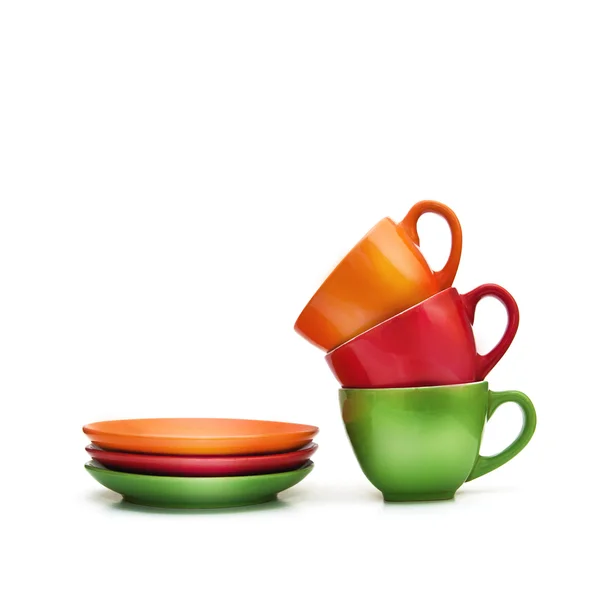 Colorful empty mugs over white background — Stockfoto