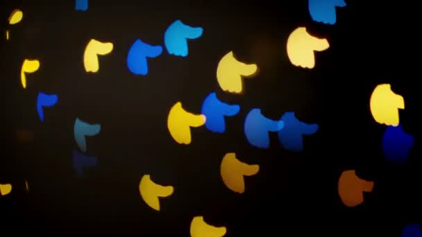 Clignotement déconcentré coloré comme et détestent les lumières festives en forme comme fond abstrait 