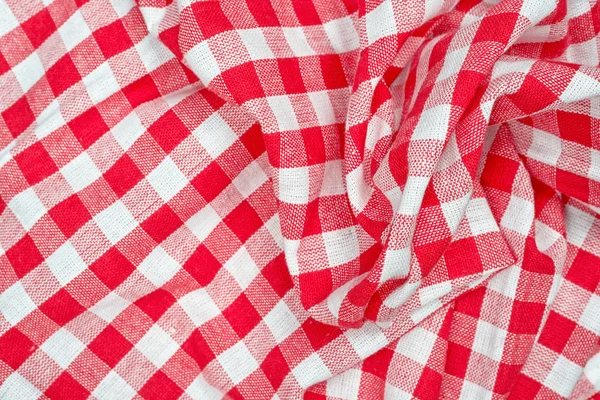 Red and white wrinkled checkered tablecloth — Stock Photo, Image