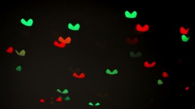 Renkli yanıp sönen kalp bokeh Festival ışık arka plan defocused.