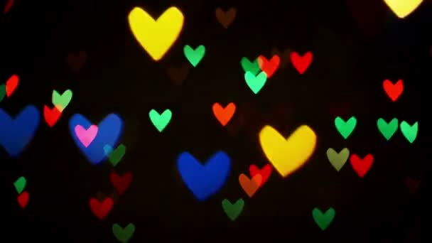 Coloré clignotant clignotant coeur bokeh lumières festives — Video