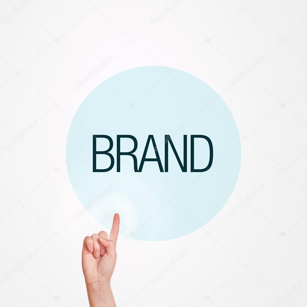 Caucasian female hand pushing Brand button. Concept of brand awareness.