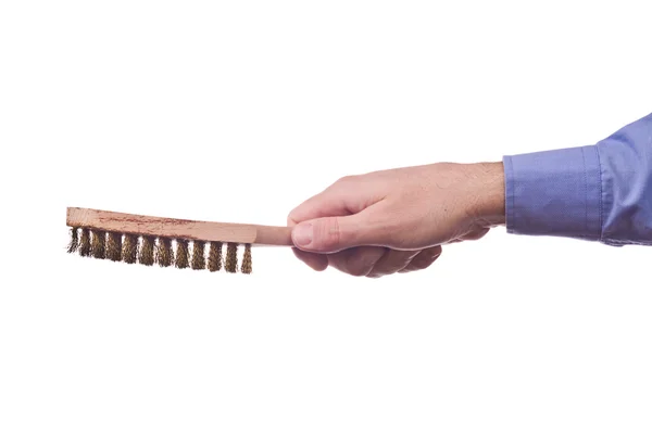 Male worker's hand holding steel wire bristes brush — Stock Photo, Image