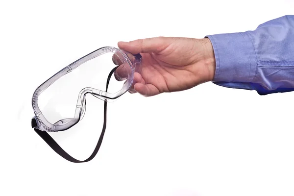 Male worker's hand holding protective goggles — Stock Photo, Image