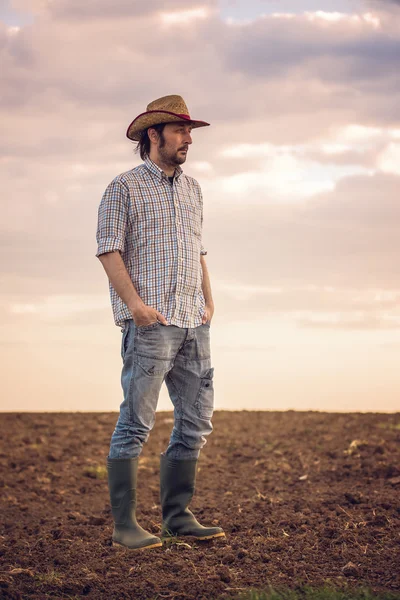 Male Farmer Standing on Fertile Agricultural Farm Land Soil — Stock Photo, Image