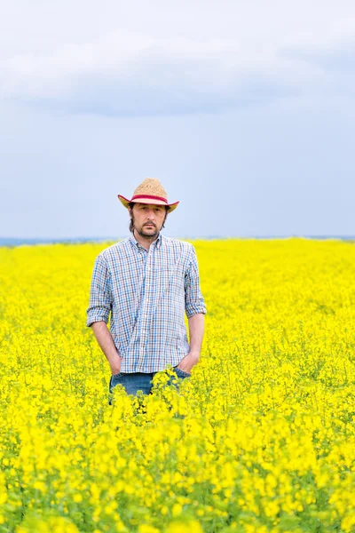 Farmer Standing in Oilseed Rapeseed Cultivated Agricultural Fiel — Stock Photo, Image