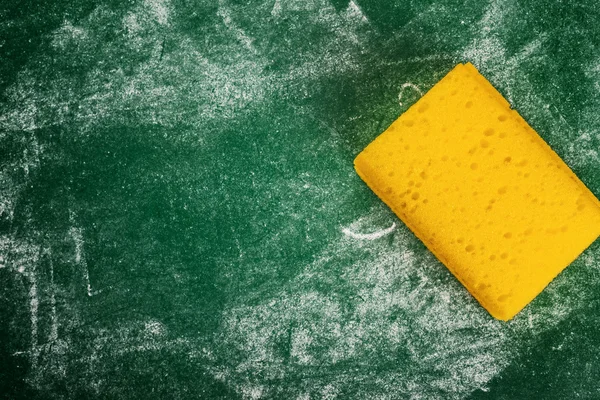 Yellow Sponge and Green Chalkboard — Stock Photo, Image