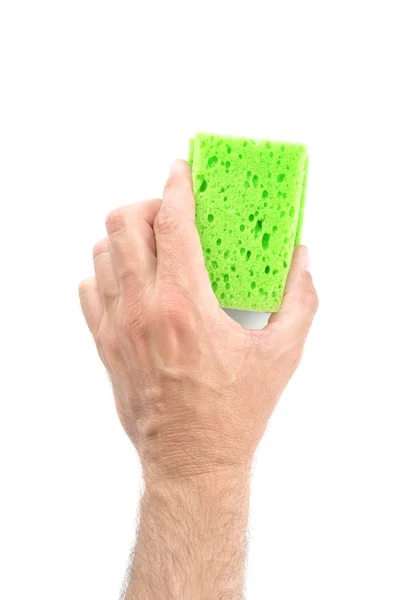 Spugna verde per la pulizia della mano maschile su sfondo bianco — Foto Stock