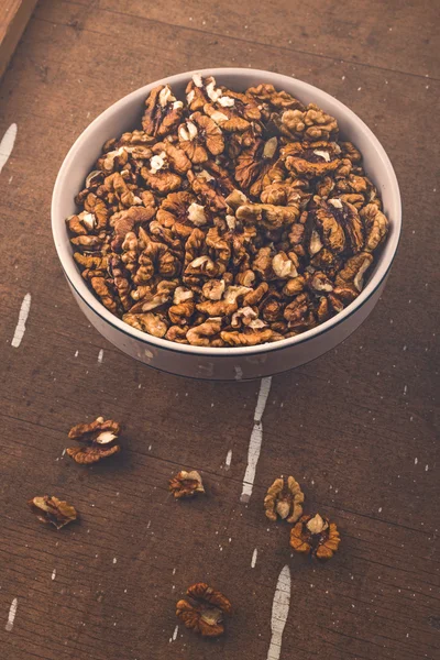 Walnut Kernels in Bowl on Brown Rustic Wood Plank Background — Stock Photo, Image