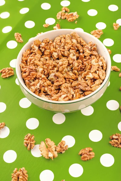 Walnut Kernels in Bowl on Polka Dotted Background — Stock Photo, Image