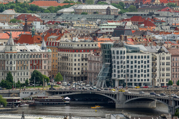 PRAGUE, CZECH REPUBLIC - MAY 23, 2015: Dancing House, Also Known As Fred and Ginger, Designed by Vlado Milunic and Frank O. Gehry on the Rasinovo Nabrezi Along with Other Examples of Distinctive Prague Architecture.
