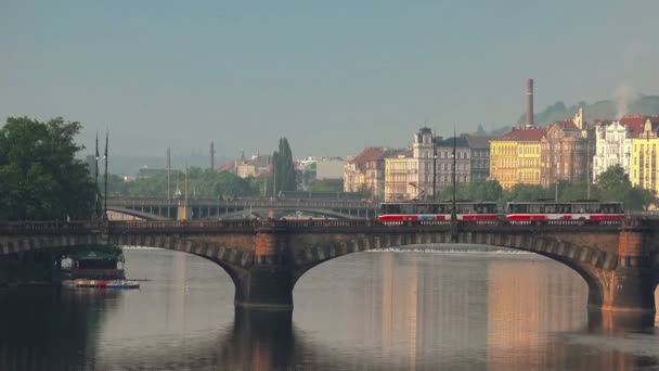 Prague Tram Passing the Bridge over Vltava River — Stock Video