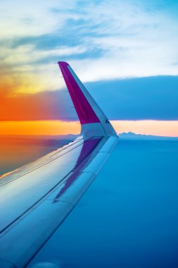 Airplane Wing Seen Through Porthole Window
