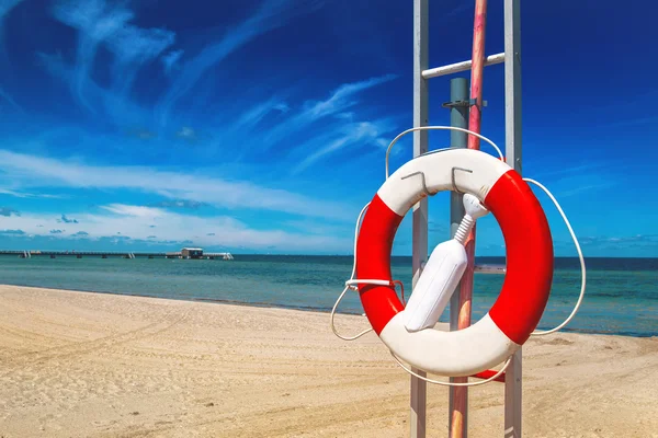 Lifebuoy, Life Preserver on Sandy Beach — Stock Photo, Image