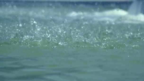 Heavy rain falling on water surface, water drops — Stock Video